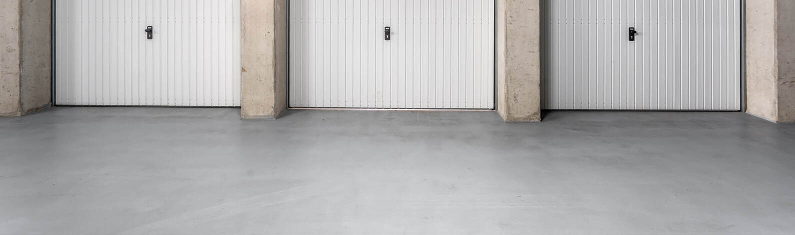 What should you use to paint a concrete floor in a garage, workshop or basement?